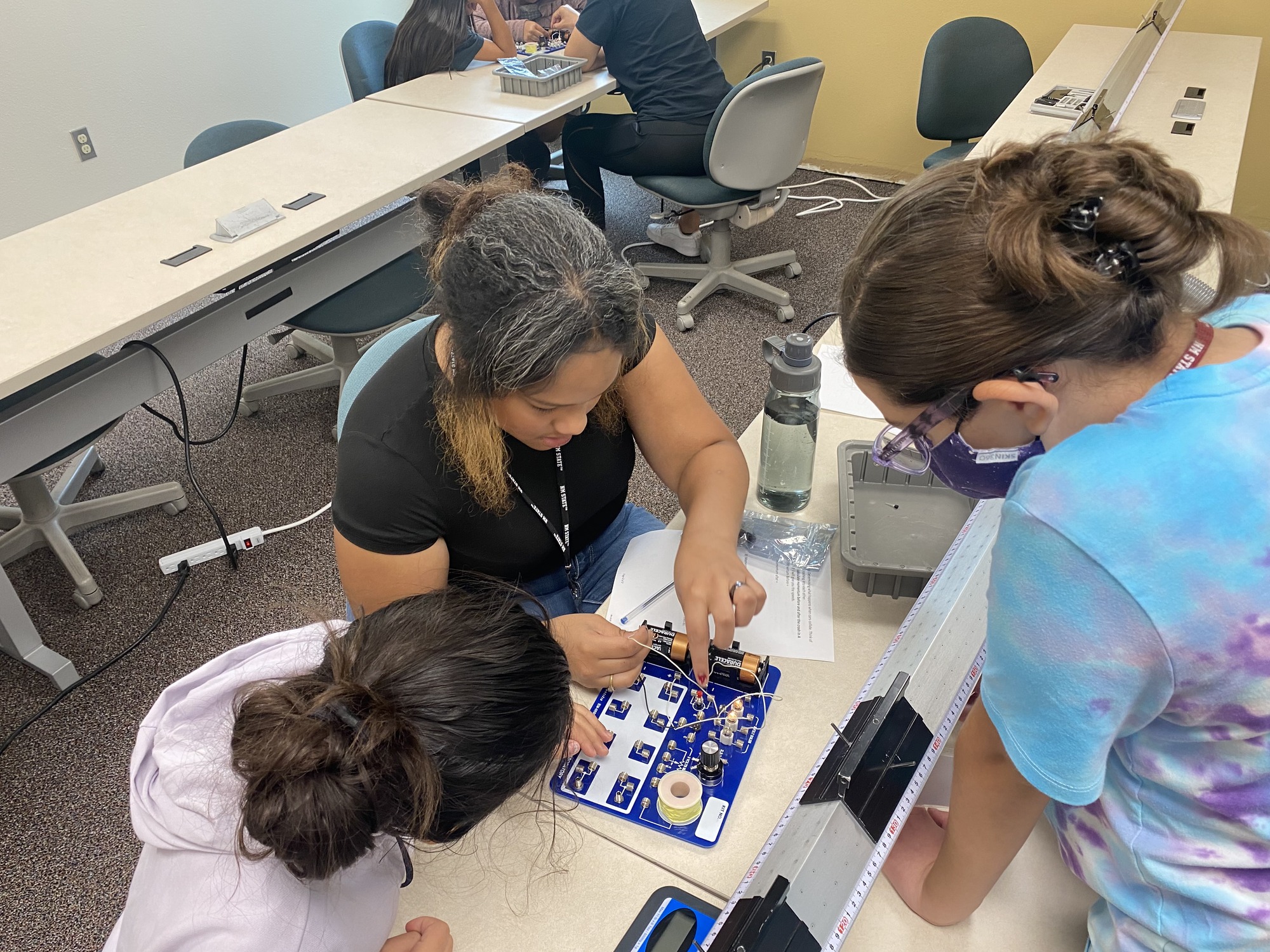 Campers investigating circuits